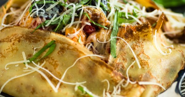 Square crepes with savory chicken and mushroom filling with parmesan